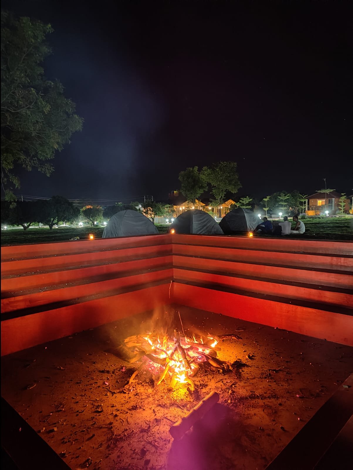 Night-time bonfire beside the camping area